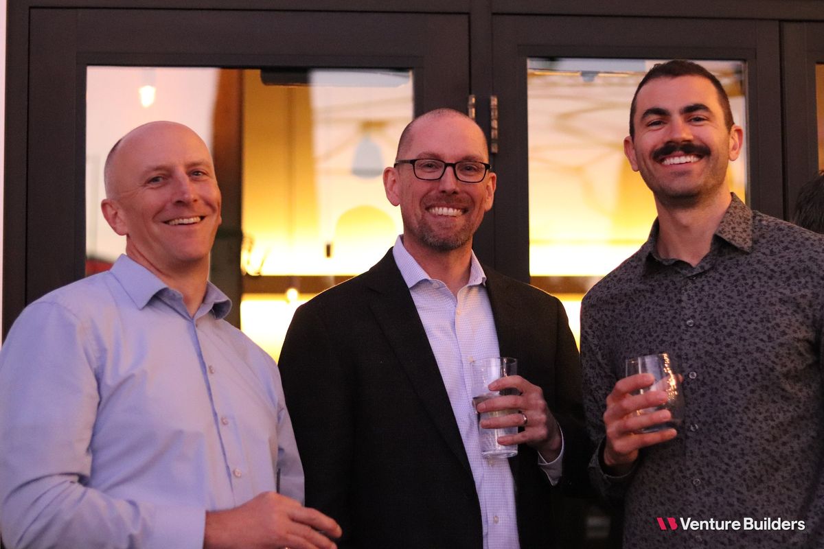 Three guests with drinks at the dinner